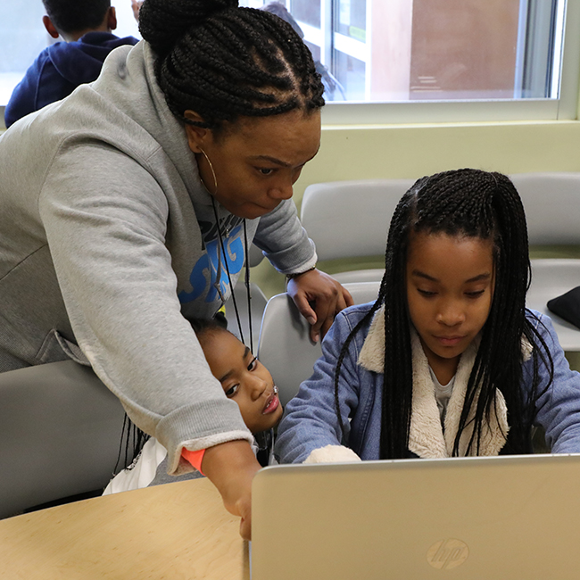 Coding Instructor with Two Girls